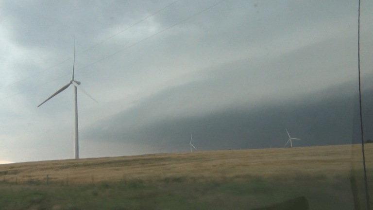 Lots of energy coming out of the El Reno supercell. Video capture from the south looking across wind farm near Union City