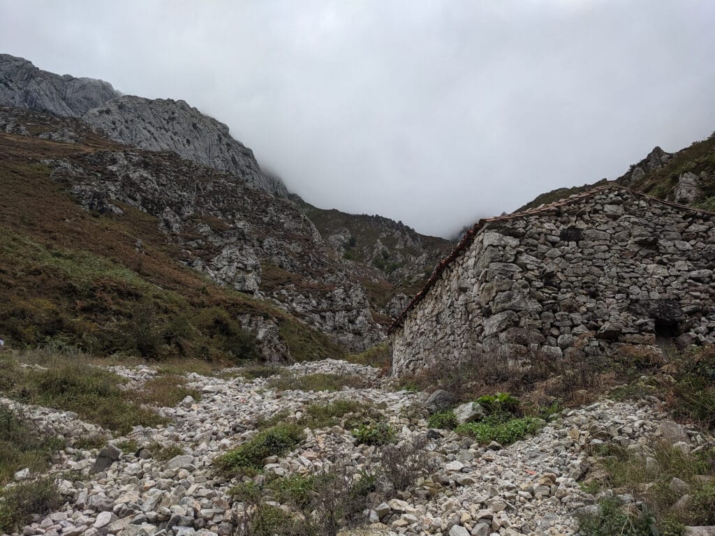 Stone Building in front of the Mountains